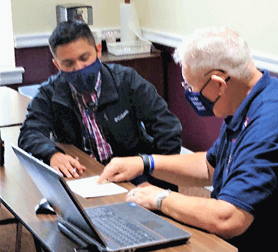 Newest Knight of Council 6451 Fernando Mejia during his online Combined Degree Exlemplificatio with Grand Knight George Brown
